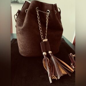 New dark brown suede bucket bag with tassel